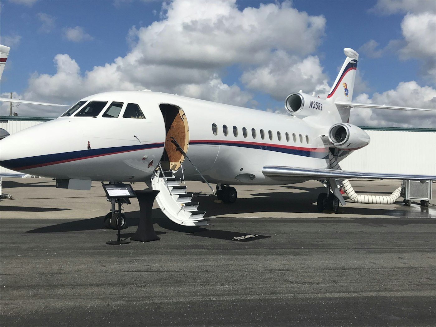 Private jet on the tarmac with stairs deployed